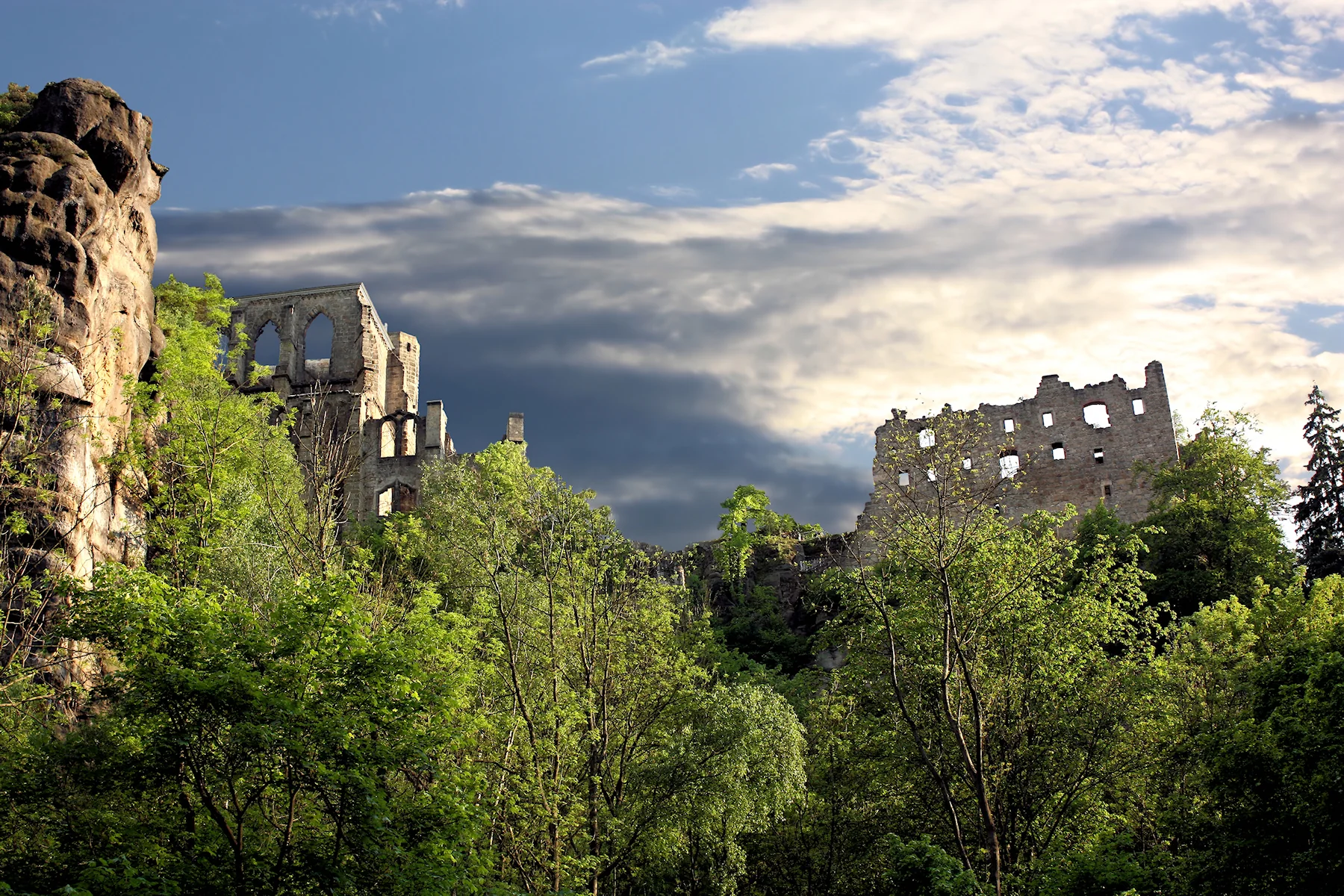 Ruins of Oybin monastery among the sandstone and forest in Saxony