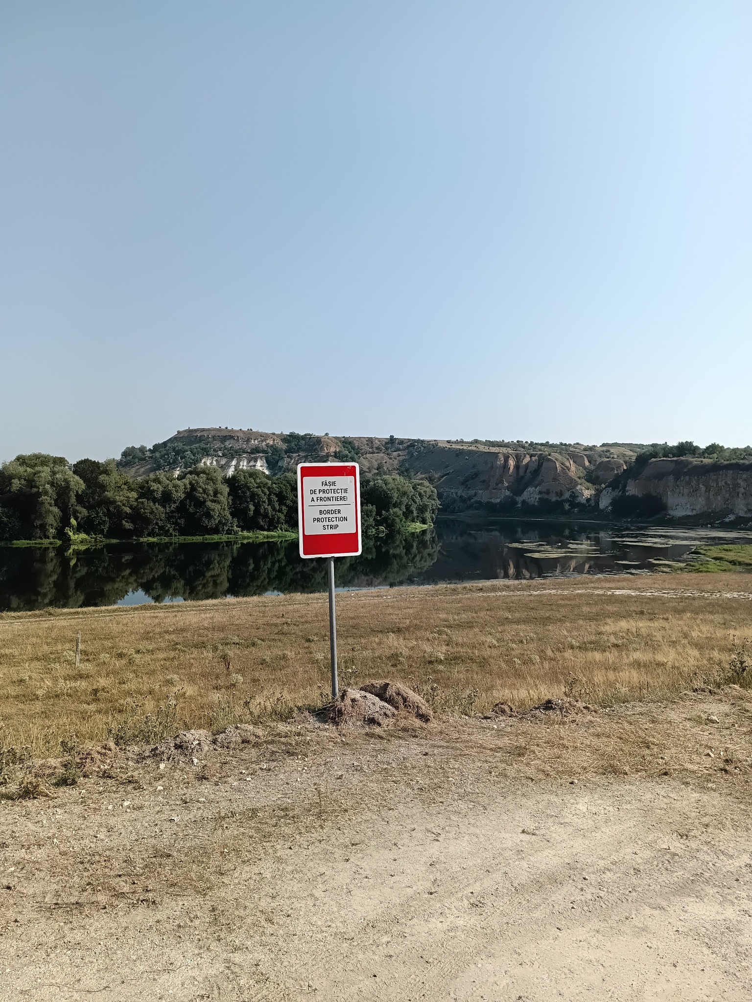 Border protection strip sign beside the Dniester near Soroca