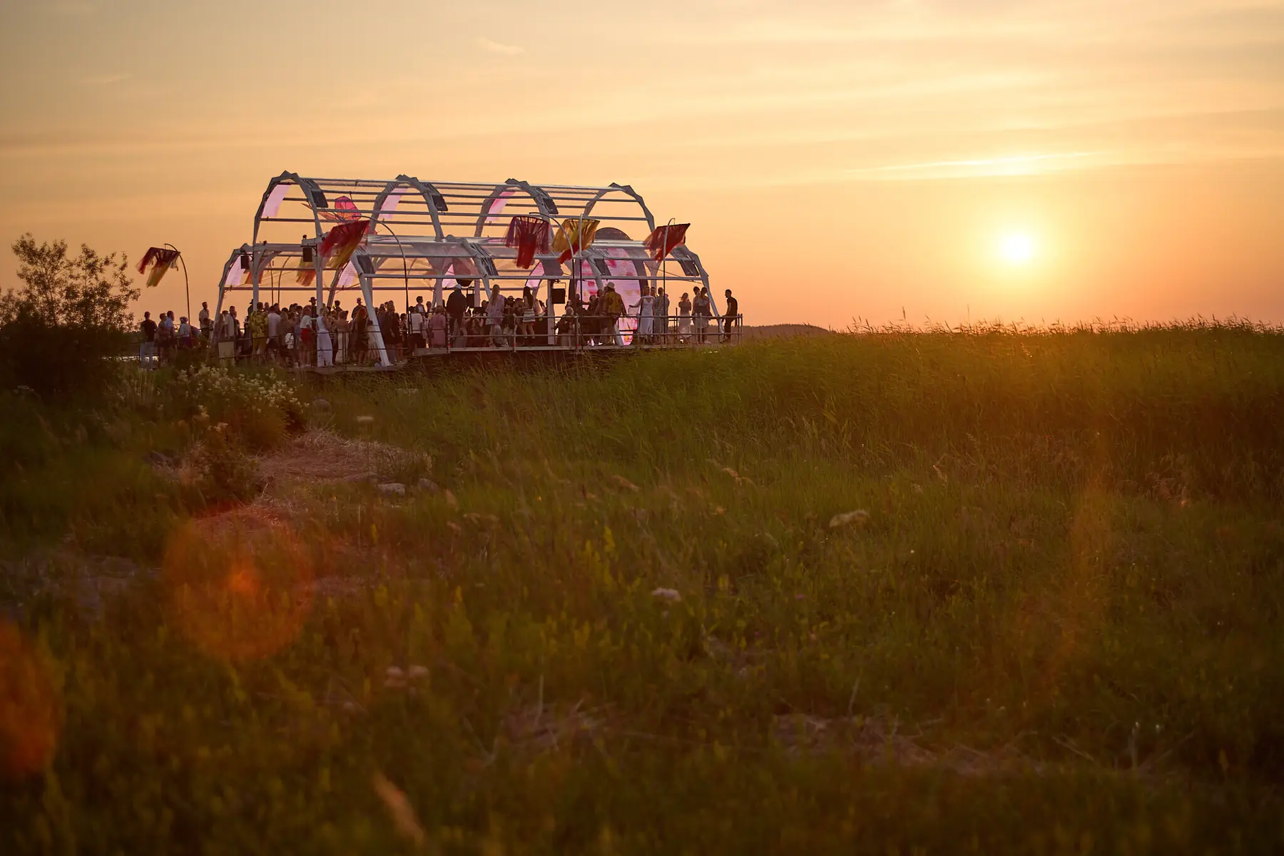 I Land Sound stage and festival visitors at sunset on Saaremaa