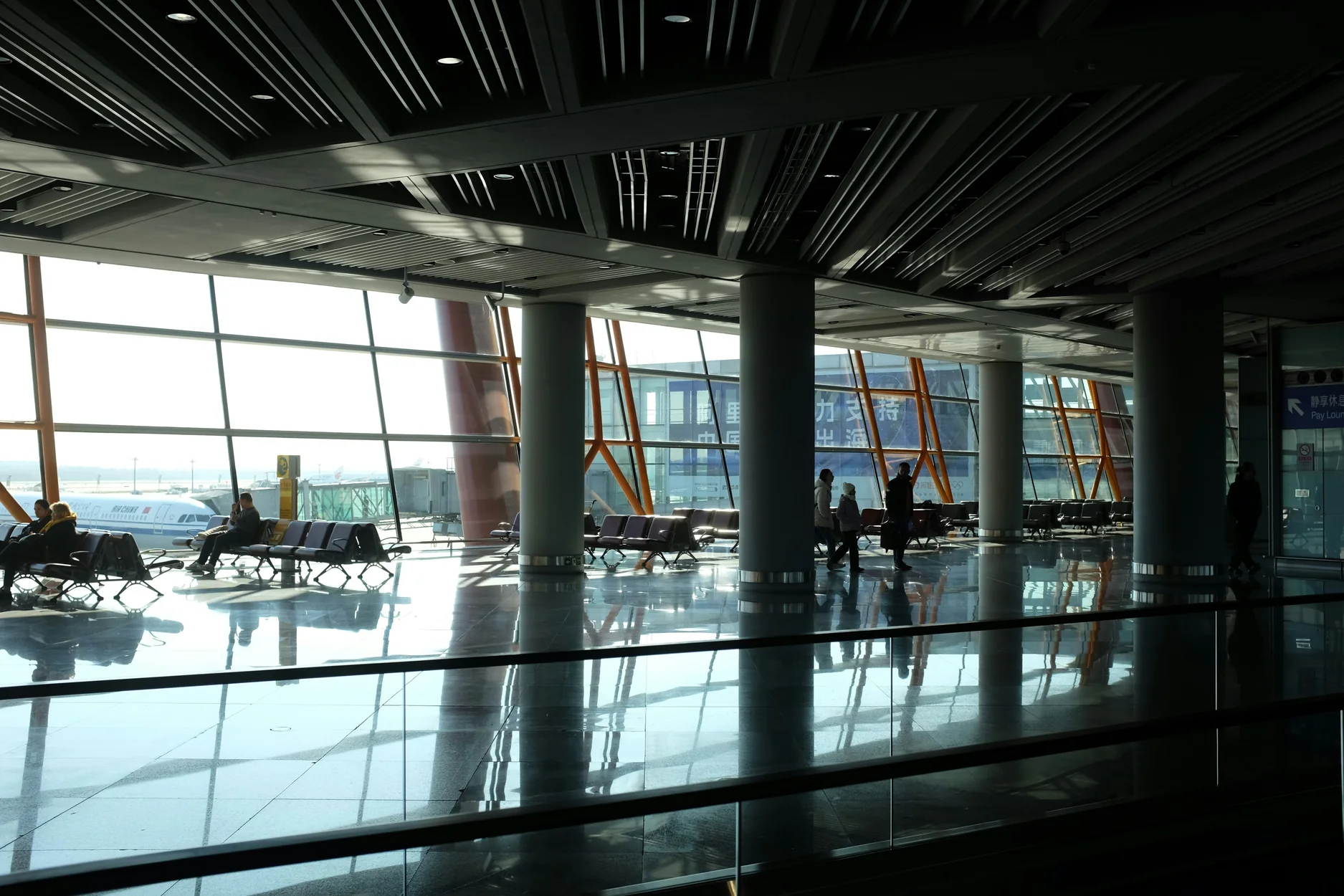 Airport departure lounge overlooking aircraft gates