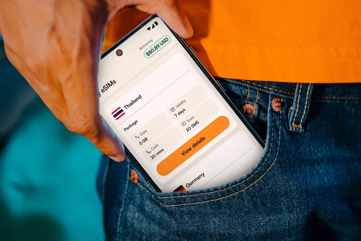 A traveller checking mobile data information on a smartphone