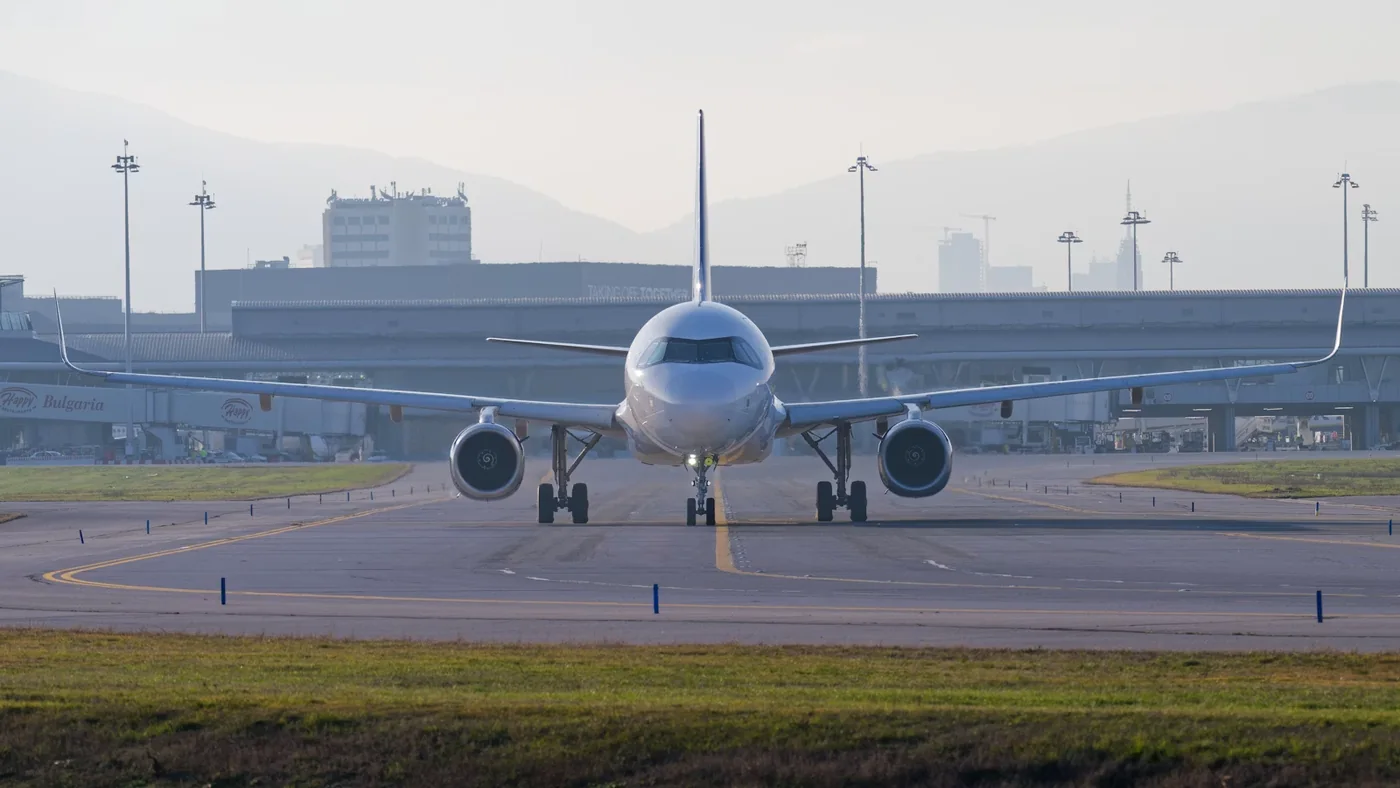 A passenger aircraft taxiing on an airport runway