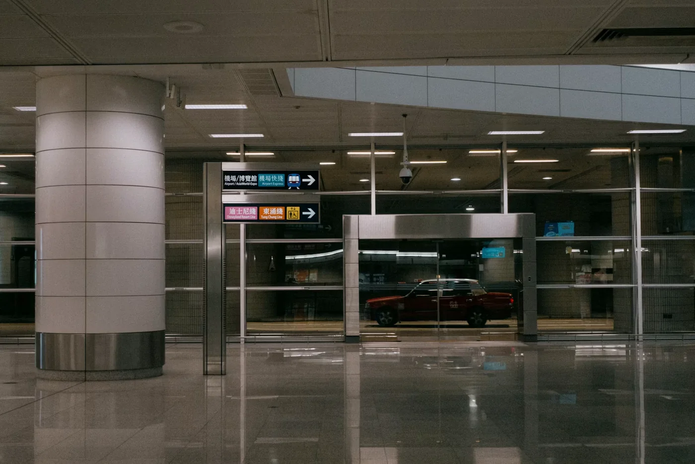 A taxi waiting outside an airport terminal